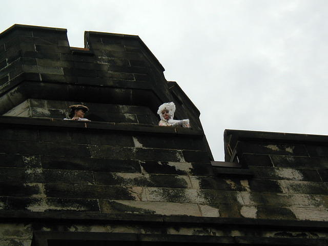 "Marie Antoinette" taunts the crowd drinking pink champagne.